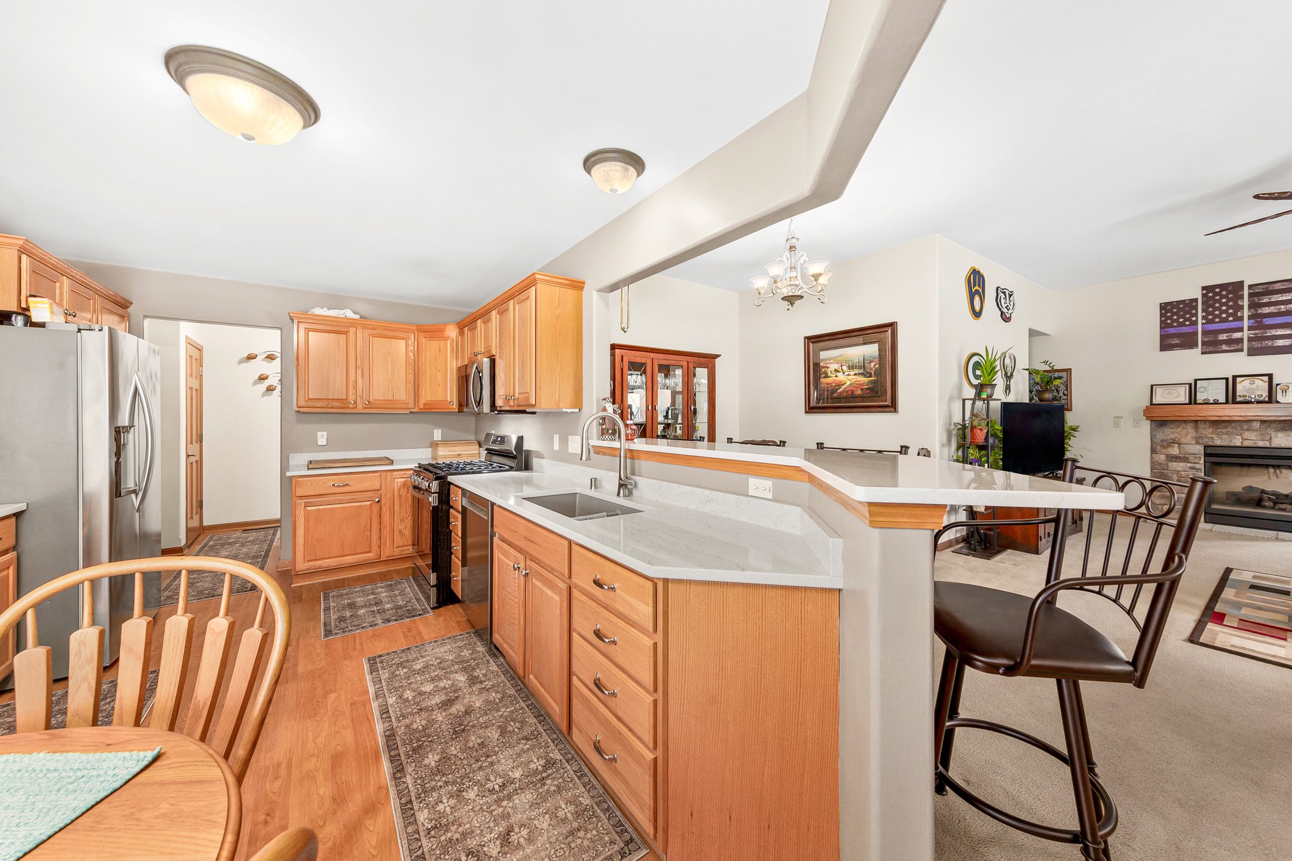 Traditional Open Plan Kitchen Kitchen Remodel by Cheesehead Construction project photo